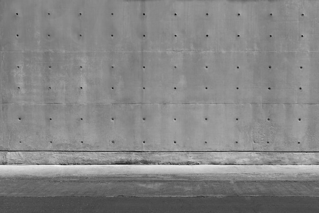 Mur et sol de texture béton gris foncé. Abstrait