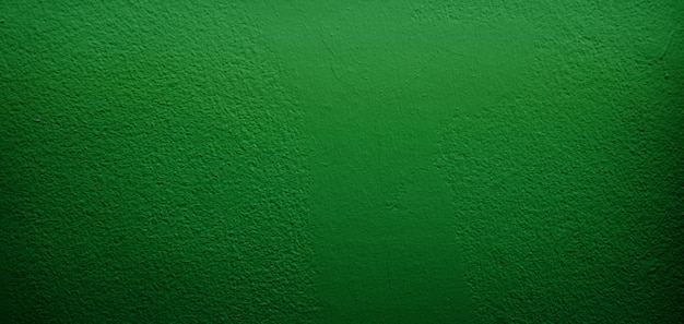 mur de texture rugueuse de grunge de béton de ciment vert avec un fond noir et un fond vert