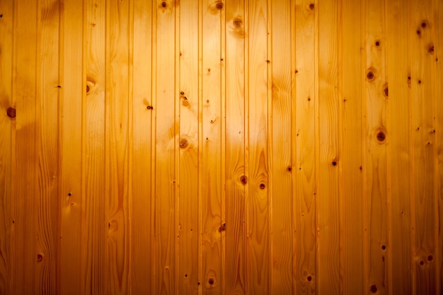 Mur de toile de fond finition brillante en planches de bois laquées aux couleurs marron orange