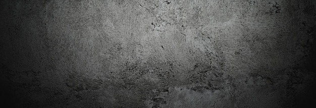 Murs sombres effrayants texture de ciment en béton noir légèrement clair pour le fond Rayures de brosse sur le mur