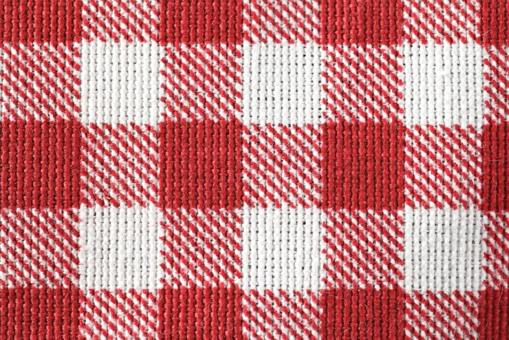 Photo une nappe à carreaux rouge et blanc avec un motif à carreaux.