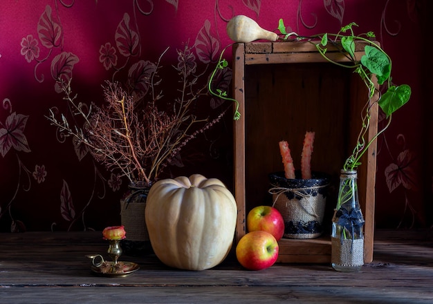 Nature morte à la citrouille sur fond de bois