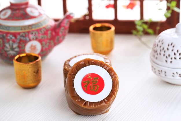 Nian Gao Aussi Niangao Un Gâteau De Riz Sucré, Un Dessert Populaire Mangé Pendant Le Nouvel An Chinois. Il était à L'origine Utilisé Comme Offrande Dans Les Cérémonies Rituelles. Caractère Chinois Signifie Fortune