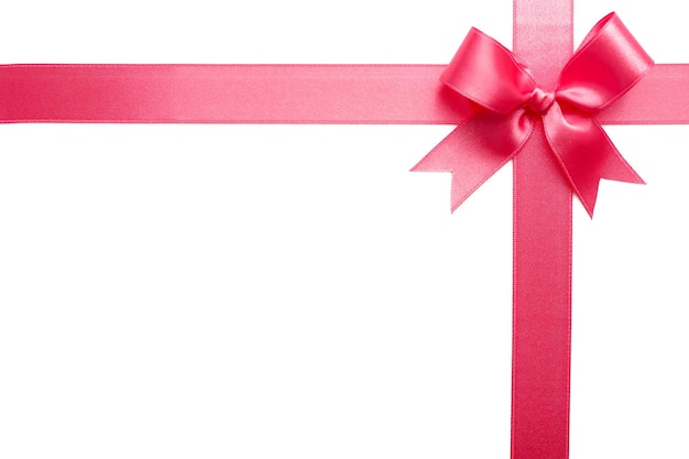 Un nœud à ruban rose sur fond blanc