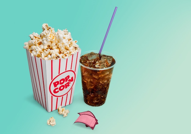 Nourriture de pop-corn en boîte et cola sur fond