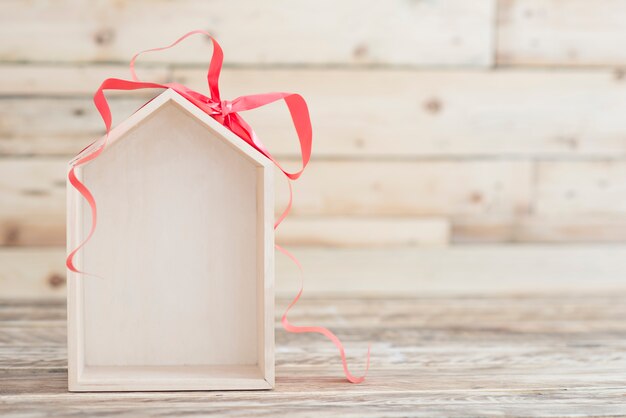 Photo nouveau concept de maison fond en bois