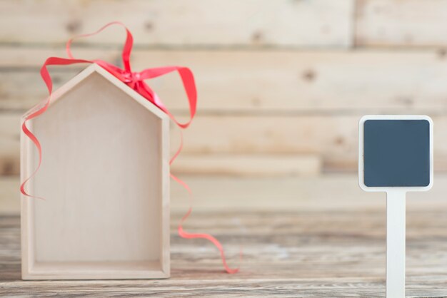 Photo nouveau concept de maison fond en bois