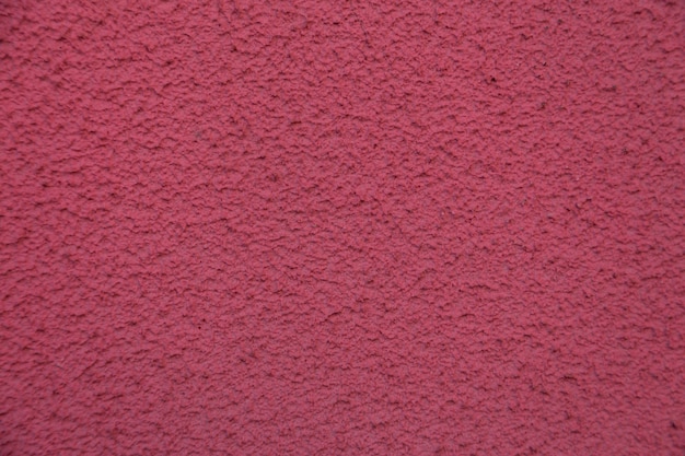 Nouveau mur de ciment rose. Beau stuc en béton. ciment peint. mur de texture de fond