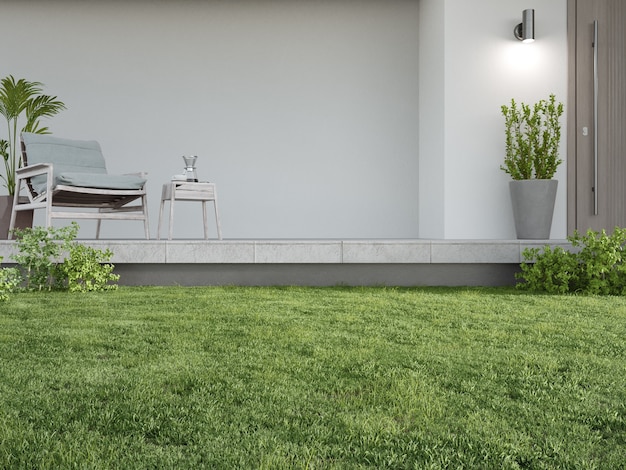 Nouvelle maison avec fauteuil sur terrasse sol en béton et mur blanc vide