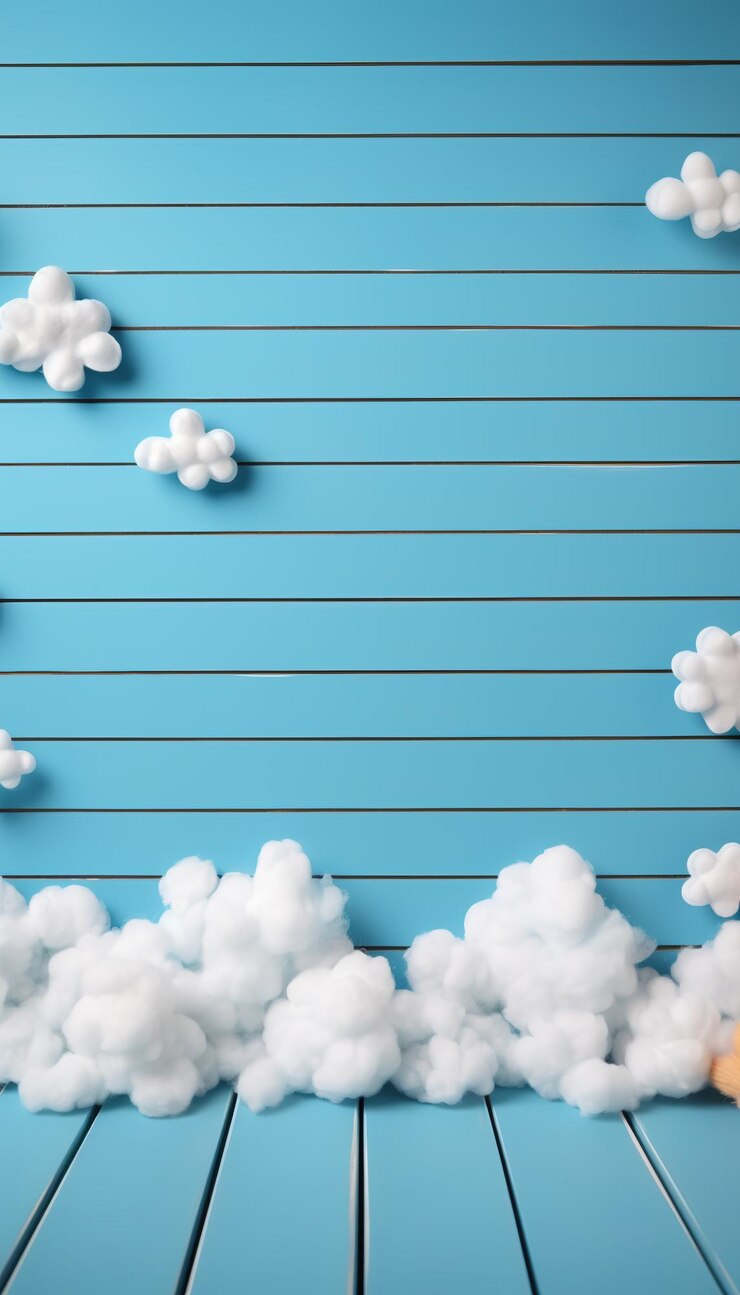 Photo des nuages blancs sur un fond en bois bleu clair isolé
