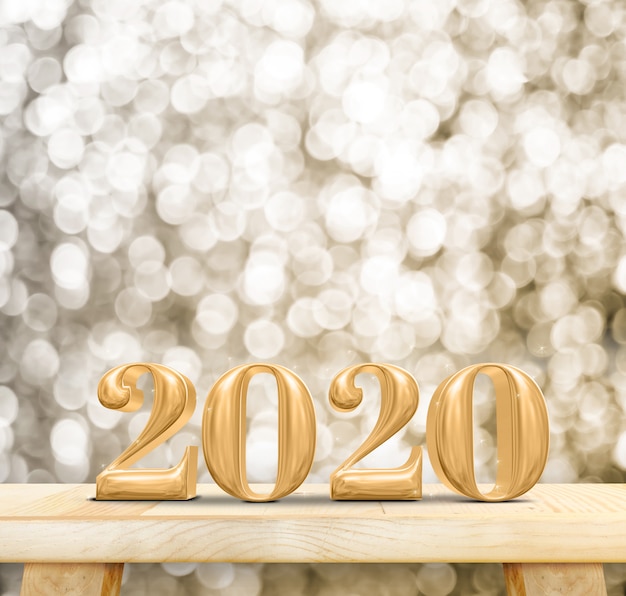 Numéro de bois 2020 bonne année sur table en bois avec mur de bokeh doré étincelant