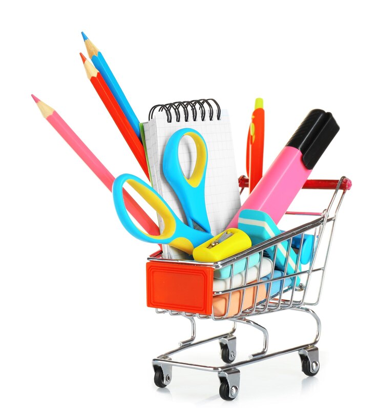 Photo objets de papeterie lumineux dans un mini chariot de supermarché isolé sur fond blanc