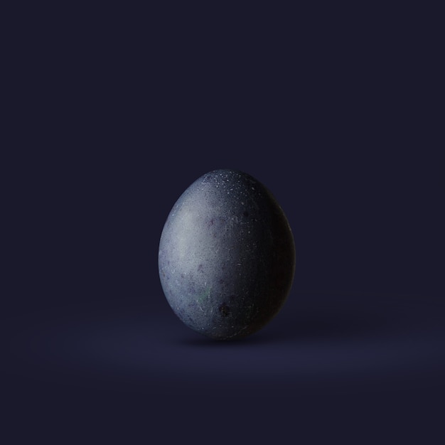 Oeuf de Pâques bleu foncé isolé sur fond bleu foncé. Style minimaliste pour une carte postale