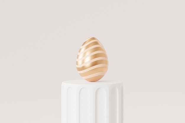 Oeuf de Pâques décoré d'or sur podium blanc