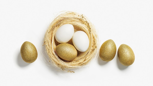 Oeufs de couleur dorée dans le nid de paille sur fond blanc Oeuf d'or élégant pour le printemps de pâques