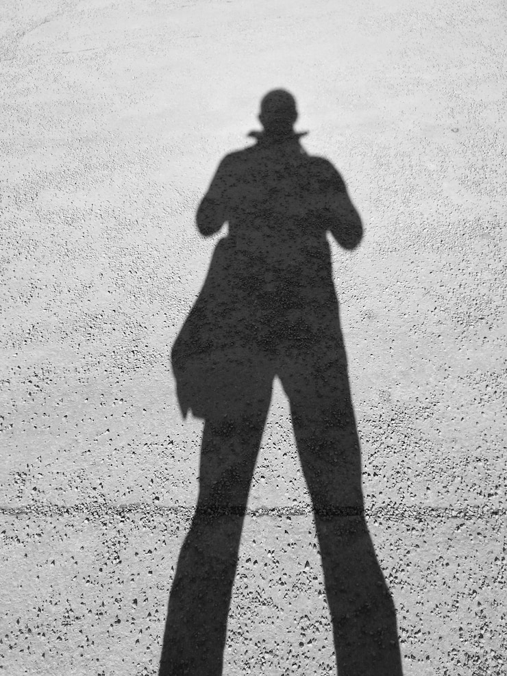 Photo ombre d'homme sur le mur