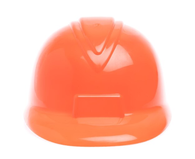 Photo orange de casque de sécurité isolé sur fond blanc