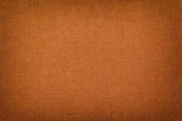 Orange d'un matériau textile avec motif en osier, agrandi.