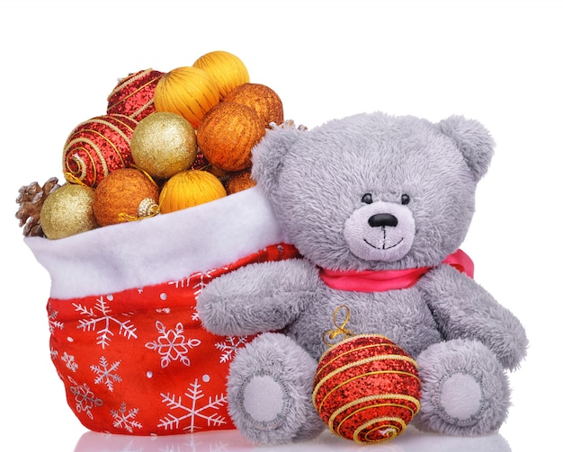 Photo ours en peluche avec sac de père noël rempli de jouets