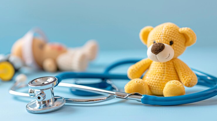 Photo un ours en peluche avec un stéthoscope dessus et un stétoscope sur la table