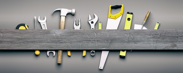 Outils à main sur fond de bois gris illustration 3d