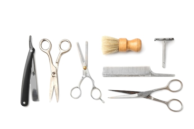 Outils vintage de salon de coiffure sur surface blanche