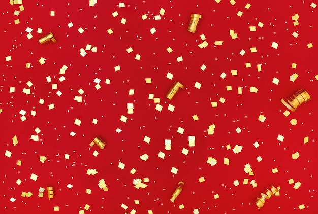 Photo paillettes d'or sur fond rouge