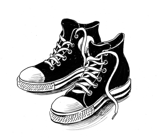 Paire de chaussures de sport. Dessin noir et blanc à l'encre