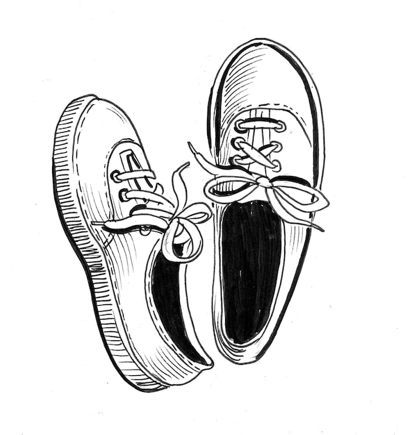 Paire de chaussures de sport. Dessin noir et blanc à l'encre