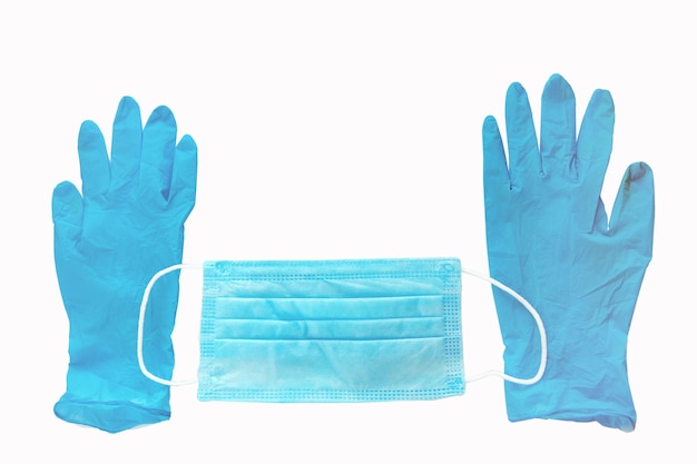 Une paire de gants en latex médical bleu et un masque de protection jetable sur fond blanc Protectio