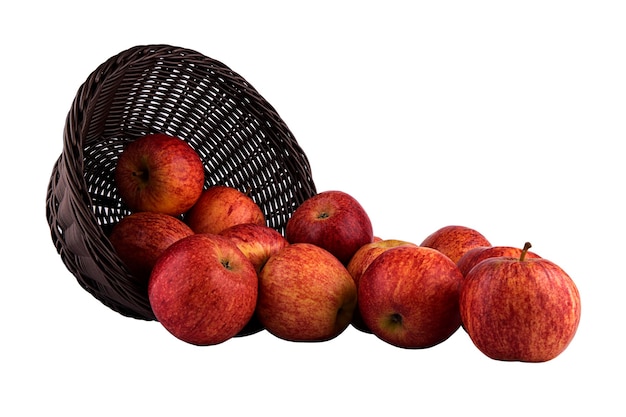 Le panier tourné avec des pommes rouges isolé sur fond blanc