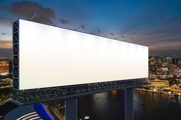 Panneau d'affichage routier blanc vierge avec fond de paysage urbain de Singapour la nuit Affiche publicitaire de rue maquette rendu 3D Vue latérale Le concept de communication marketing pour vendre une idée