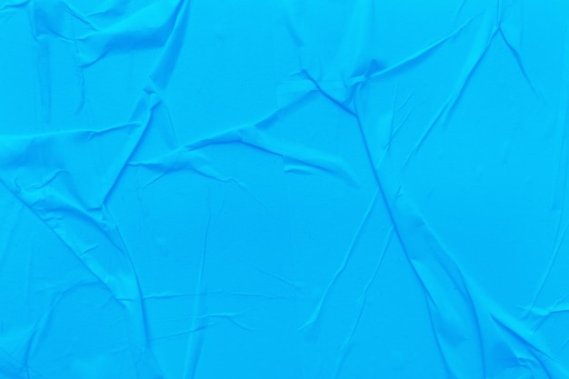 Le papier bleu vierge est un fond de texture froissé Arrière-plans de texture de papier froissé à diverses fins