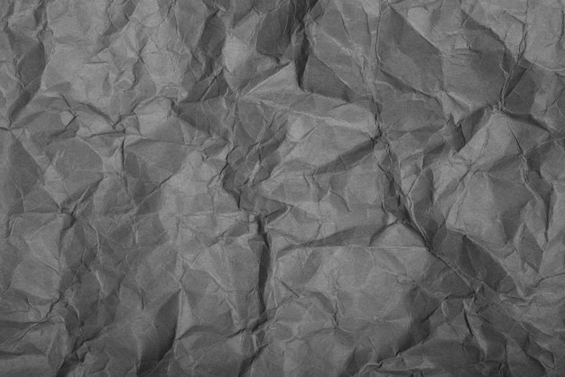 Papier gris ridé Texture de fond du papier froissé