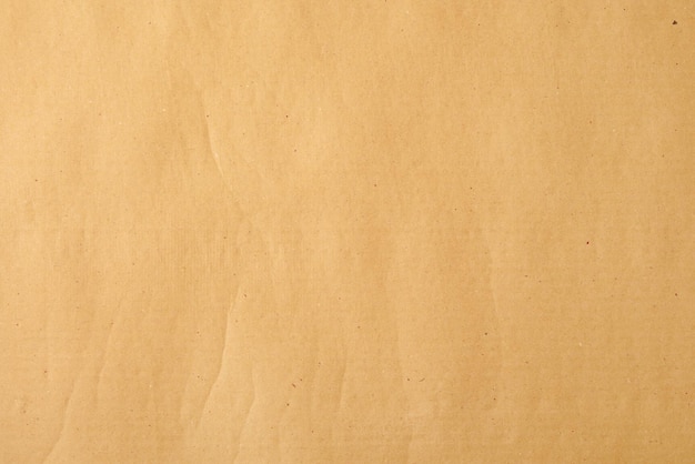 Papier kraft beige jaune avec des touches de fond pour la conception