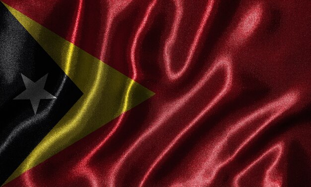 Papier peint par le drapeau du Timor-Leste et agitant le drapeau par le tissu