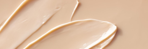 Papier peint à la texture crème beige de produits de soins de la peau ou de maquillage en gros plan Macro de tache cosmétique
