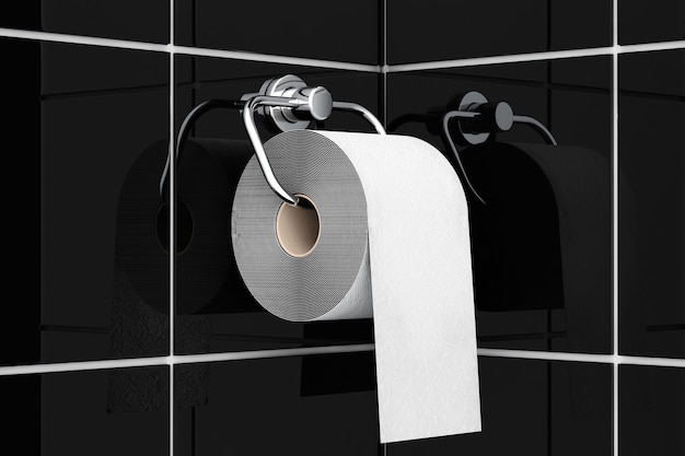 Papier toilette sur support chromé sur fond de carreaux noirs