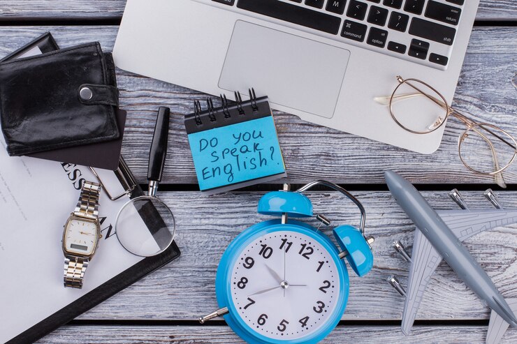 Photo parles-tu anglais. accessoires de voyage et d'affaires à plat.
