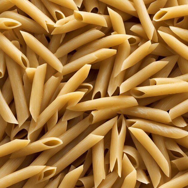 Photo pasta de penne crue non cuite vue supérieure de la nourriture italienne