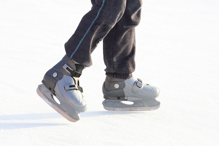 Photo patinage pieds sur la patinoire