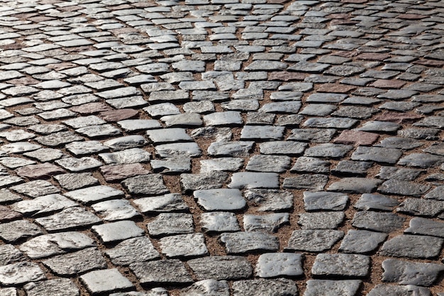 Le pavé de pavés de granit dans le rétro-éclairage