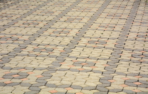 Pavés de brique sur une texture de fond de trottoir