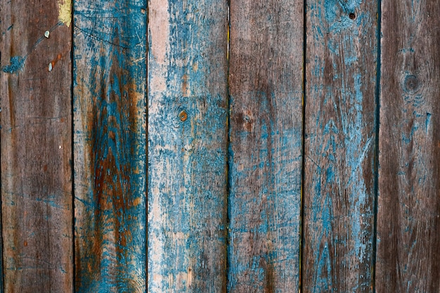 Photo peint en bandes de bois bleu texture endommagée, papier peint et fond, gros plan. conception rustique grunge, décoration et concept de détails extérieurs ou intérieurs