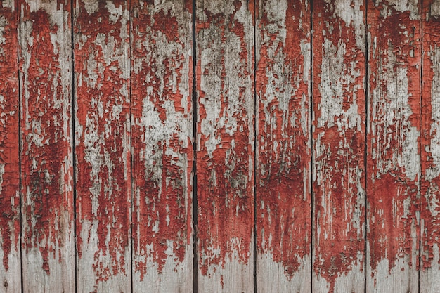 Peint le vieux fond de mur rouge en bois.