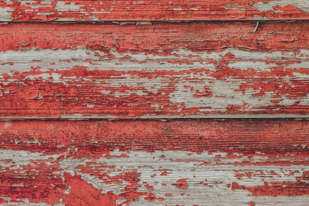 Peint le vieux fond de mur rouge en bois.