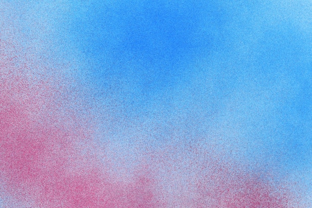Peinture en aérosol rouge et bleu sur fond de papier blanc