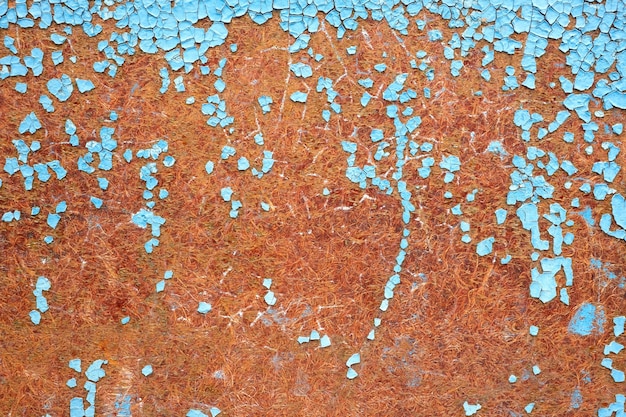 Peinture bleue écaillée Ancien motif de peinture fissurée sur fond rouillé Peinture endommagée Ancienne plaque rayée