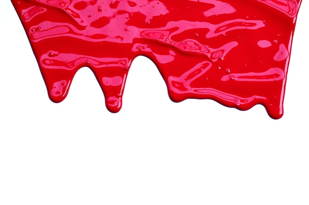 Peinture couleur rouge dégoulinant isolé