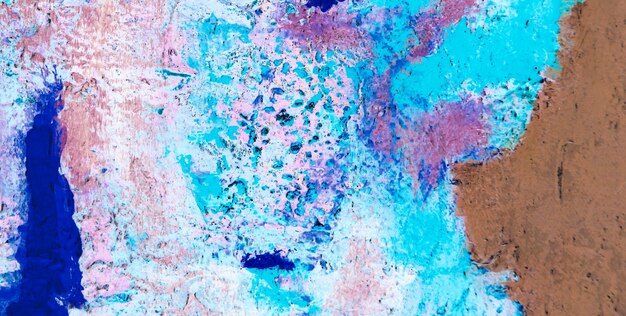 Photo une peinture d'un fond abstrait bleu et rose avec un point brun à gauche